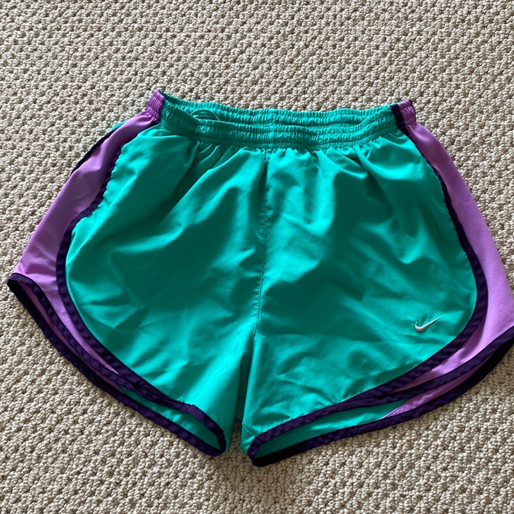Teal and purple Nike running shorts
